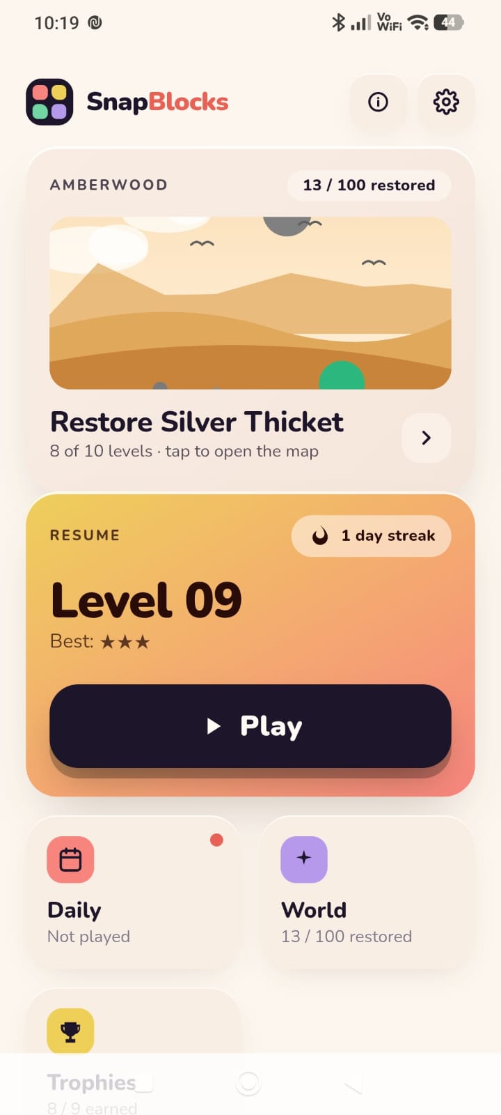 SnapBlocks home screen showing the Amberwood region and a level to resume